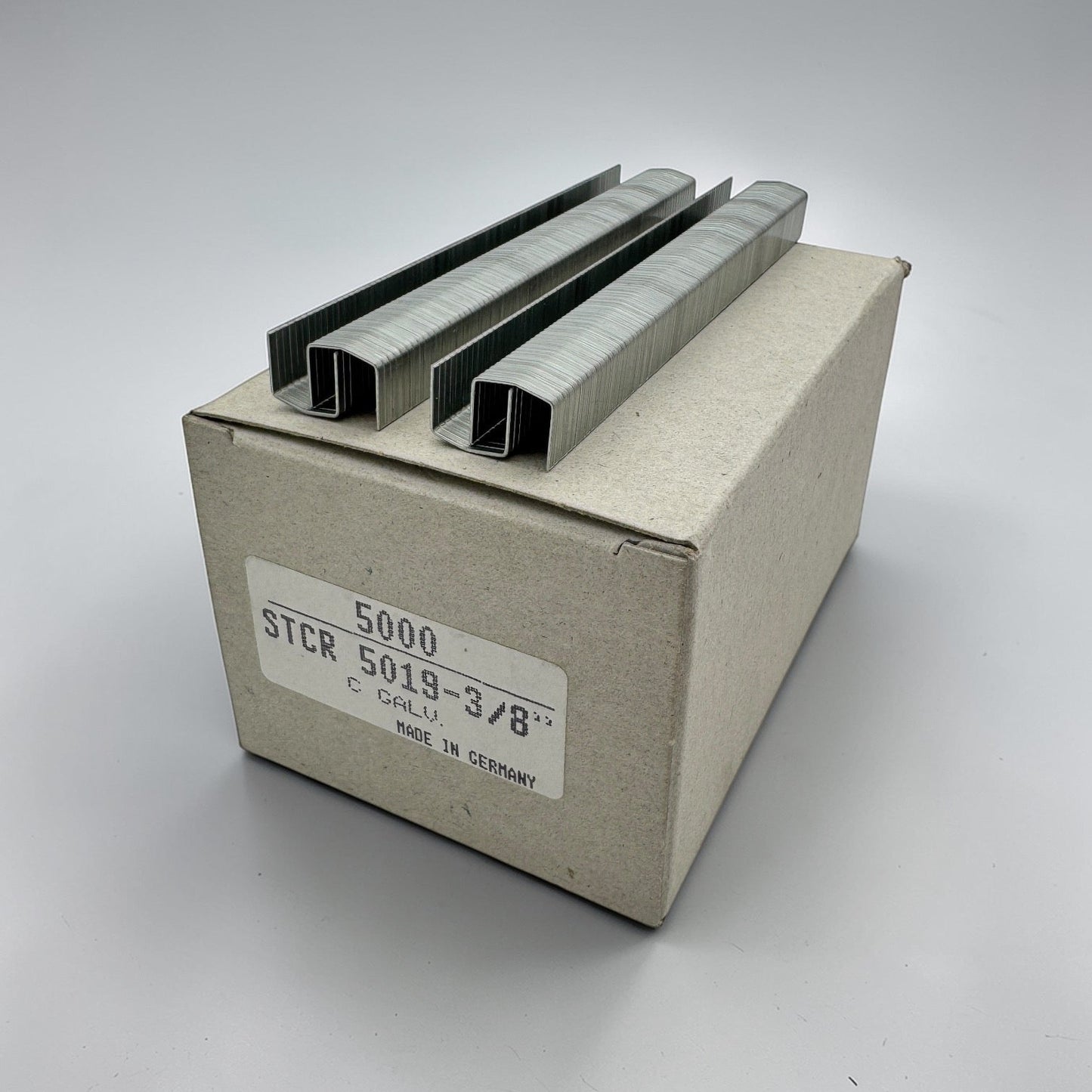 box of staples on top of a cardboard box